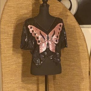 Sequined top with a butterfly